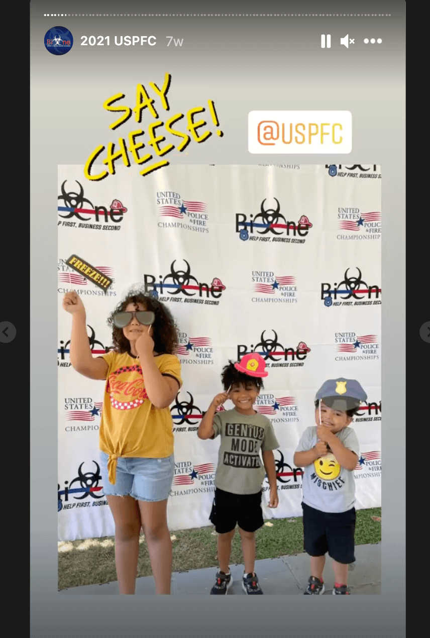 Family enjoying props at the Bio-One booth at the U.S. Police and Fire Championships
